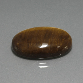 Натуральный коричневый tiger's eye 20,98 карата огранка овал, непрозрачный