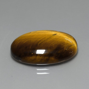 Натуральный коричневый tiger's eye 19,59 карата огранка овал, непрозрачный