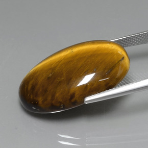 Натуральный коричневый tiger's eye 19,59 карата огранка овал, непрозрачный