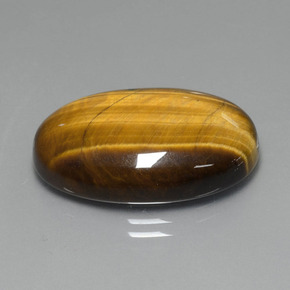 Натуральный коричневый tiger's eye 20,74 карата огранка овал, непрозрачный