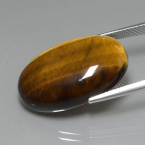 Натуральный коричневый tiger's eye 20,74 карата огранка овал, непрозрачный