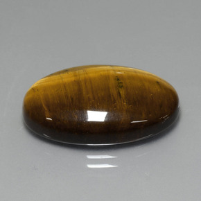 Натуральный коричневый tiger's eye 19,40 карата огранка овал, непрозрачный