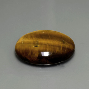 Натуральный коричневый tiger's eye 22,43 карата огранка овал, непрозрачный