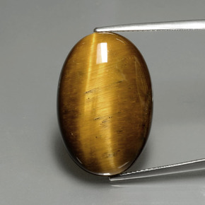 Натуральный коричневый tiger's eye 20,21 карата огранка овал, непрозрачный
