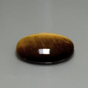 Натуральный коричневый tiger's eye 20,21 карата огранка овал, непрозрачный