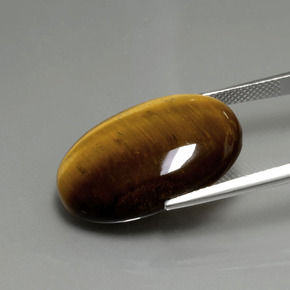 Натуральный коричневый tiger's eye 20,21 карата огранка овал, непрозрачный