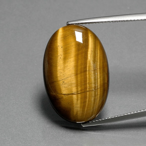 Натуральный коричневый tiger's eye 19,87 карата огранка овал, непрозрачный
