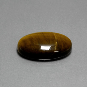 Натуральный коричневый tiger's eye 19,87 карата огранка овал, непрозрачный