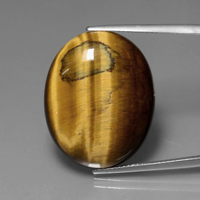 Натуральный коричневый tiger's eye 22,74 карата огранка овал, непрозрачный