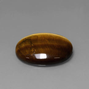 Натуральный коричневый tiger's eye 22,74 карата огранка овал, непрозрачный