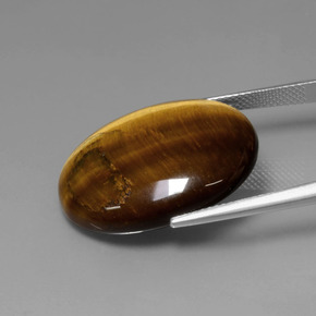Натуральный коричневый tiger's eye 22,74 карата огранка овал, непрозрачный
