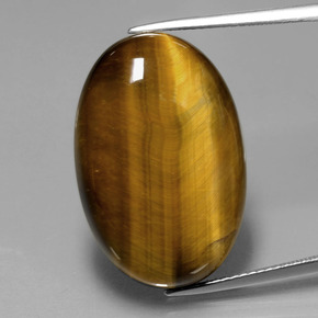 Натуральный коричневый tiger's eye 20,54 карата огранка овал, непрозрачный