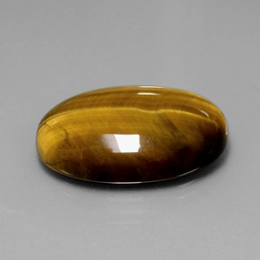 Натуральный коричневый tiger's eye 20,54 карата огранка овал, непрозрачный