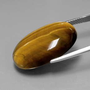 Натуральный коричневый tiger's eye 20,54 карата огранка овал, непрозрачный