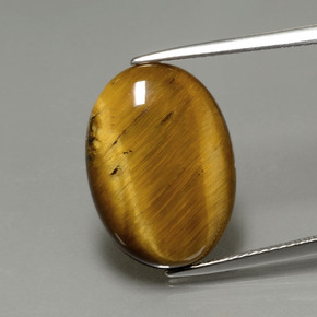 Натуральный коричневый tiger's eye 7,51 карата огранка овал, непрозрачный