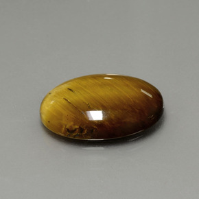 Натуральный коричневый tiger's eye 7,51 карата огранка овал, непрозрачный