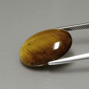 Натуральный коричневый tiger's eye 7,51 карата огранка овал, непрозрачный