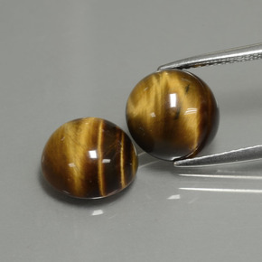 Натуральный коричневый tiger's eye  карата огранка круг, непрозрачный