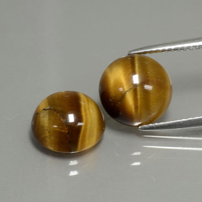 Натуральный коричневый tiger's eye  карата огранка круг, непрозрачный