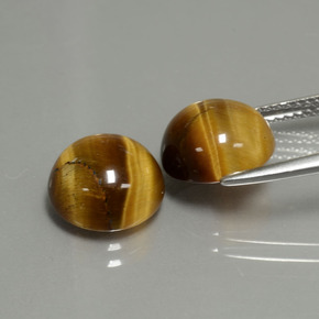 Натуральный коричневый tiger's eye  карата огранка круг, непрозрачный