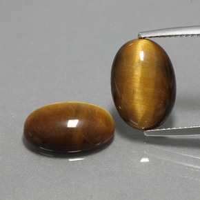 Натуральный коричневый tiger's eye  карата огранка овал, непрозрачный