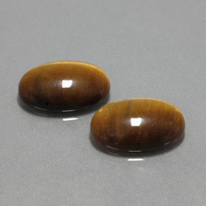 Натуральный коричневый tiger's eye  карата огранка овал, непрозрачный