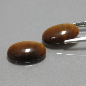 Натуральный коричневый tiger's eye  карата огранка овал, непрозрачный