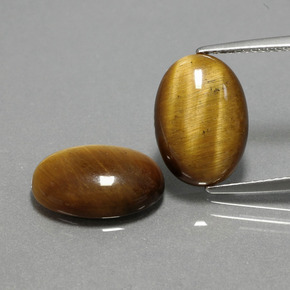 Натуральный коричневый tiger's eye  карата огранка овал, непрозрачный