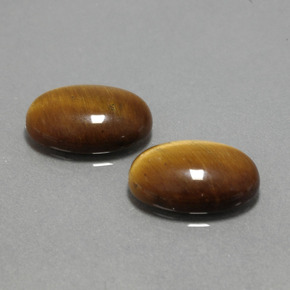 Натуральный коричневый tiger's eye  карата огранка овал, непрозрачный