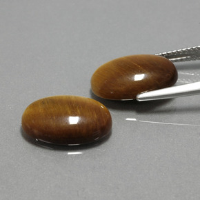Натуральный коричневый tiger's eye  карата огранка овал, непрозрачный