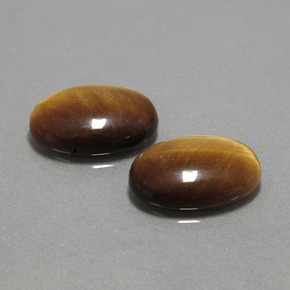 Натуральный коричневый tiger's eye  карата огранка овал, непрозрачный