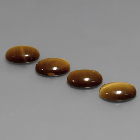 Натуральный коричневый tiger's eye  карата огранка овал, непрозрачный