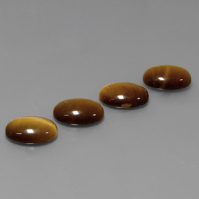Натуральный коричневый tiger's eye  карата огранка овал, непрозрачный