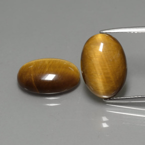 Натуральный коричневый tiger's eye  карата огранка овал, непрозрачный