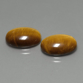 Натуральный коричневый tiger's eye  карата огранка овал, непрозрачный