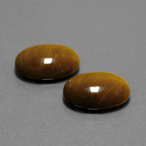 Натуральный коричневый tiger's eye  карата огранка овал, непрозрачный