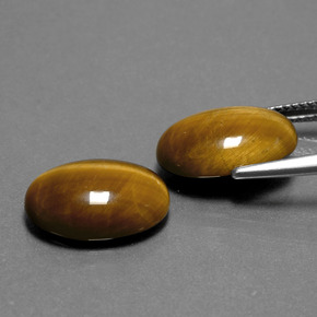 Натуральный коричневый tiger's eye  карата огранка овал, непрозрачный