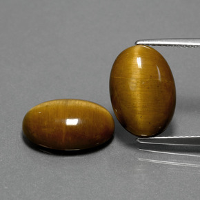 Натуральный коричневый tiger's eye  карата огранка овал, непрозрачный