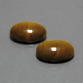 Натуральный коричневый tiger's eye  карата огранка овал, непрозрачный