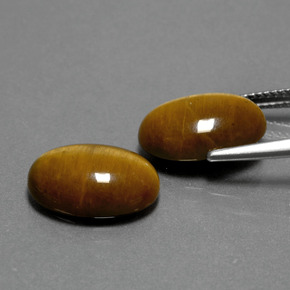 Натуральный коричневый tiger's eye  карата огранка овал, непрозрачный