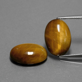 Натуральный коричневый tiger's eye  карата огранка овал, непрозрачный