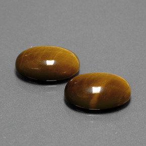 Натуральный коричневый tiger's eye  карата огранка овал, непрозрачный