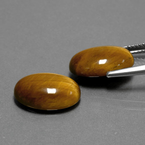 Натуральный коричневый tiger's eye  карата огранка овал, непрозрачный