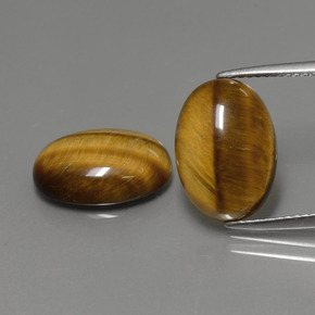 Натуральный коричневый tiger's eye  карата огранка овал, непрозрачный