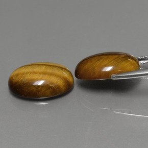 Натуральный коричневый tiger's eye  карата огранка овал, непрозрачный