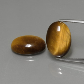 Натуральный коричневый tiger's eye  карата огранка овал, непрозрачный