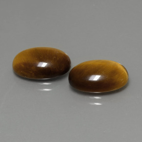 Натуральный коричневый tiger's eye  карата огранка овал, непрозрачный