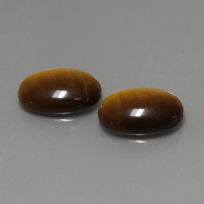Натуральный коричневый tiger's eye  карата огранка овал, непрозрачный
