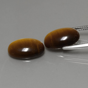 Натуральный коричневый tiger's eye  карата огранка овал, непрозрачный