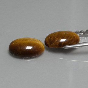 Натуральный коричневый tiger's eye 9,08 карата огранка овал, непрозрачный